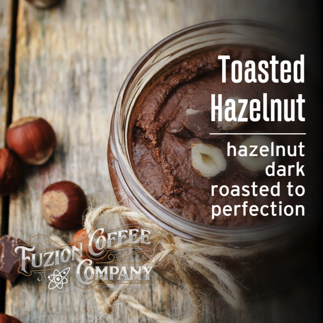 Jar of toasted hazelnut spread with hazelnuts and Fuzion Coffee Company branding.